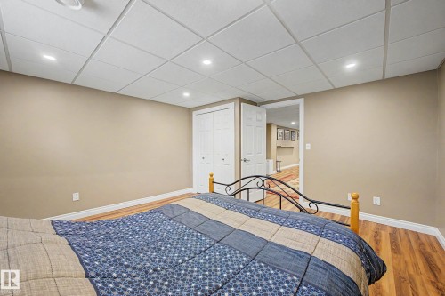 Recessed lighting illuminates wood-finish flooring and neutral wall tones - 250 197 Avenue, Edmonton, AB - Indoor