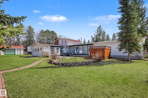 Expansive green lawn with a winding brick pathway - 250 197 Avenue, Edmonton, AB - Outdoor
