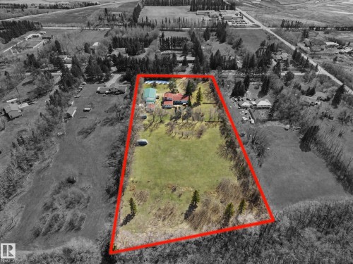 Expansive property featuring a large grassy area and mature trees - 250 197 Avenue, Edmonton, AB - Outdoor With View