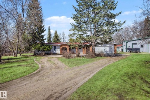 Ranch-style residence featuring a brick facade entryway and an attached garage - 250 197 Avenue, Edmonton, AB - Outdoor