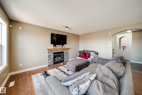 12627 16 Avenue, Edmonton, AB - Indoor Photo Showing Living Room With Fireplace