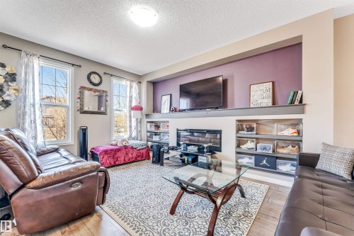 8041 Chappelle Way, Edmonton, AB - Indoor Photo Showing Living Room With Fireplace