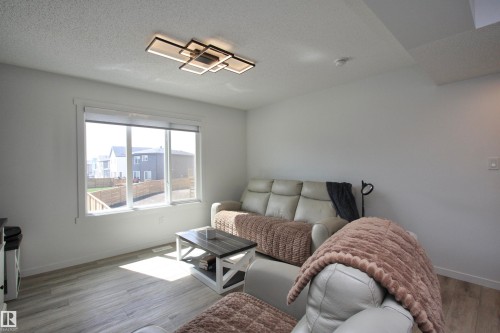 Plenty of natural light, custom motorized blinds, luxury vinyl plank flooring. - 253 Marquis Boulevard, Edmonton, AB - Indoor