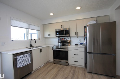 Wi-Fi-enabled appliances. - 253 Marquis Boulevard, Edmonton, AB - Indoor Photo Showing Kitchen With Stainless Steel Kitchen With Double Sink