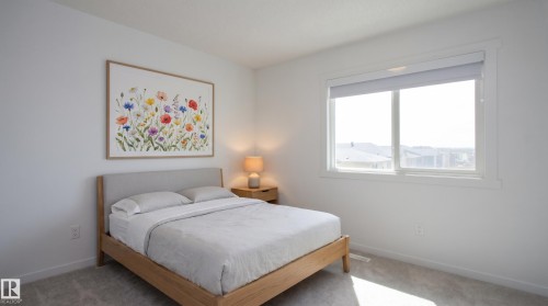 This photo is digitally staged,  this room easily accommodates a Queen bed. - 253 Marquis Boulevard, Edmonton, AB - Indoor Photo Showing Bedroom
