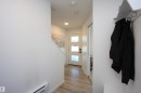 Entry from garage with convenient 1/2 bath to the right. - 253 Marquis Boulevard, Edmonton, AB  - Indoor Photo Showing Other Room 