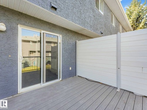 Private outdoor patio featuring composite decking - 17 15128 22 Street, Edmonton, AB - Outdoor With Exterior