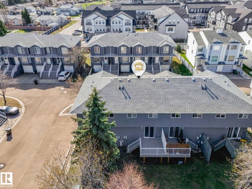 Multi-unit residential structure with gray siding and shingle roofing - 17 15128 22 Street, Edmonton, AB - Outdoor With Facade