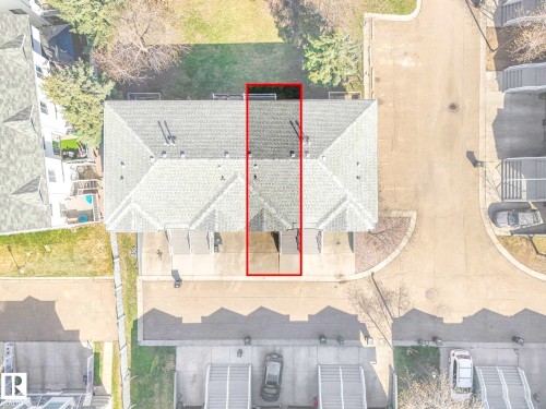 Aerial perspective highlighting a multi-unit residential property with gray shingle roofing - 17 15128 22 Street, Edmonton, AB - Outdoor