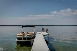 Private dock extending into the tranquil lake - 