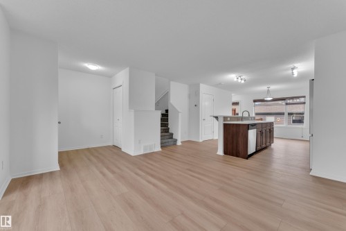 Open-concept living area with light wood-finish flooring - 2143 32 Street, Edmonton, AB - Indoor
