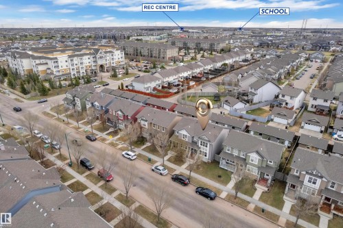 Aerial perspective showcasing a residential neighborhood with detached homes and townhomes - 2143 32 Street, Edmonton, AB - Outdoor With View