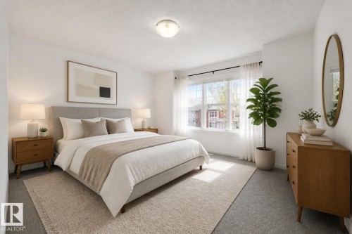 Spacious bedroom featuring light-colored carpeting, a large window with sheers and a dark curtain rod, and bright white walls - 2143 32 Street, Edmonton, AB - Indoor Photo Showing Bedroom