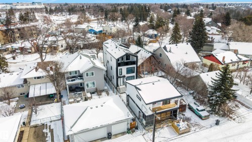 This property features a contemporary architectural style with a distinctive black and white exterior - 7927 112S Avenue, Edmonton, AB - Outdoor
