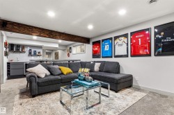 Entertainment area featuring recessed lighting, a built-in wet bar with a wine rack, subway tile backsplash, and an exposed wood beam ceiling - 