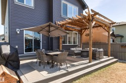 Expansive multi-level composite deck featuring a pergola - 