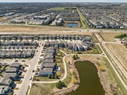 Aerial perspective showcasing a residential community with abundant green spaces - 