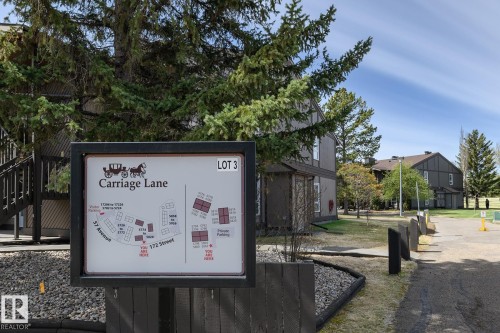 Community signage displaying a site map for "Carriage Lane" with building layouts - 5816 172 Street, Edmonton, AB - Outdoor