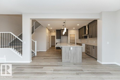 Open-concept interior featuring light wood-finish flooring - 2616 158 Street, Edmonton, AB - Indoor Photo Showing Kitchen