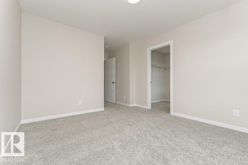 Room with neutral paint, light gray carpet, and white baseboards - 2616 158 Street, Edmonton, AB - Indoor Photo Showing Other Room