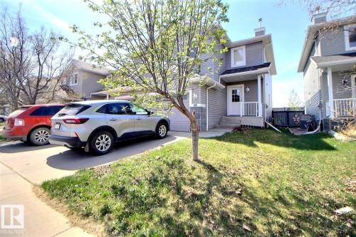 Two-story residence featuring gray siding and white trim - 170 Keystone Crescent, Leduc, AB - Outdoor
