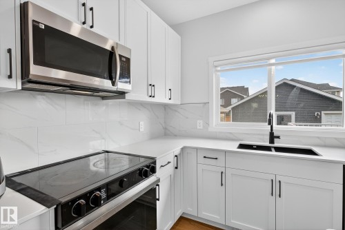 3451 169 Street, Edmonton, AB - Indoor Photo Showing Kitchen With Double Sink