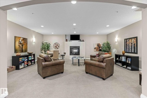 110 5211 50 Street, Stony Plain, AB - Indoor With Fireplace