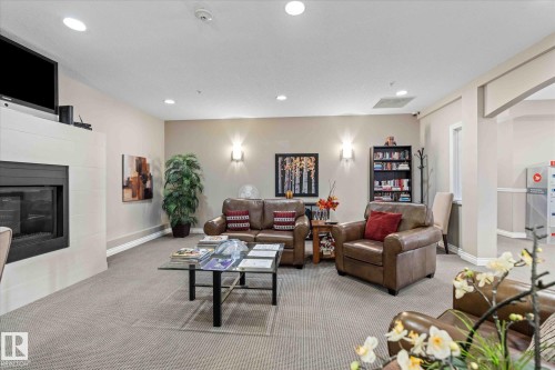 110 5211 50 Street, Stony Plain, AB - Indoor Photo Showing Living Room With Fireplace