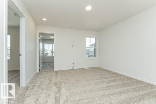 Carpeted room featuring white walls, a single window, and recessed lighting - 6271 180 Avenue, Edmonton, AB - Indoor Photo Showing Other Room