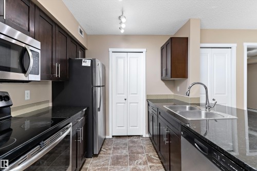 105 111 Watt Common, Edmonton, AB - Indoor Photo Showing Kitchen With Stainless Steel Kitchen With Double Sink
