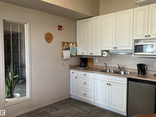 303 4004 47 Street, Drayton Valley, AB - Indoor Photo Showing Kitchen With Double Sink