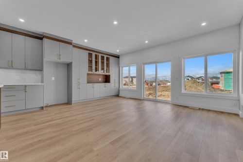 Open-concept space featuring extensive light wood-finish flooring - 3116 8 Avenue, Edmonton, AB - Indoor