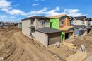 Newly constructed residence featuring beige siding and a dark shingle roof - 3116 8 Avenue, Edmonton, AB  - Outdoor 