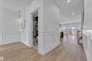 Bright entryway featuring wood-finish flooring, white wainscoting, and recessed lighting - 3116 8 Avenue, Edmonton, AB  - Indoor Photo Showing Other Room 