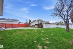 Expansive green lawn with a detached auxiliary building - 
