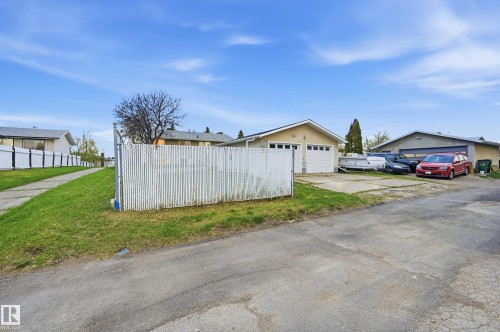 Two-car garage with white paneled doors and stucco exterior - 13903 87 Street, Edmonton, AB - Outdoor