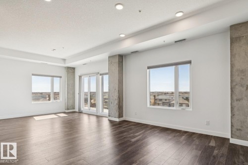 502 1316 Windermere Way, Edmonton, AB - Indoor Photo Showing Living Room