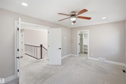 Spacious room featuring light gray carpeting and recessed lighting - 