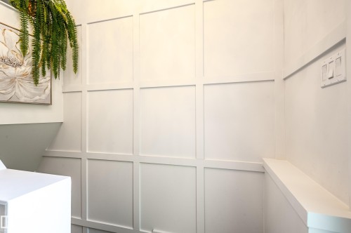 Crisp white board and batten paneling featuring a built-in wall shelf - 14604 92A Avenue, Edmonton, AB - Indoor Photo Showing Other Room
