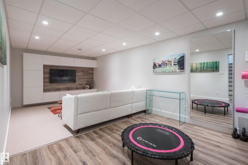 Recreation room with recessed lighting and two-tone flooring - 14604 92A Avenue, Edmonton, AB - Indoor