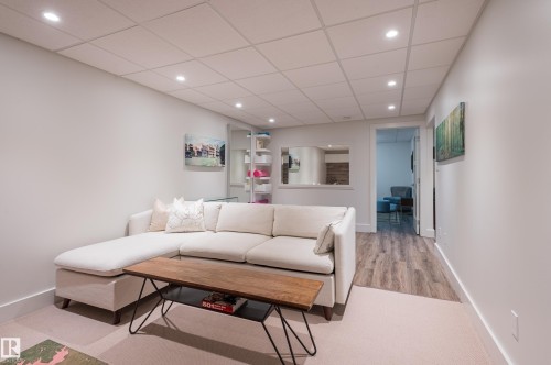 Recessed lighting illuminates this space featuring a drop ceiling and light-colored walls - 14604 92A Avenue, Edmonton, AB - Indoor