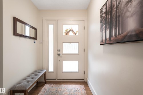 Entryway featuring a white door with multiple glass panes and a full-length sidelight - 14604 92A Avenue, Edmonton, AB - Indoor Photo Showing Other Room