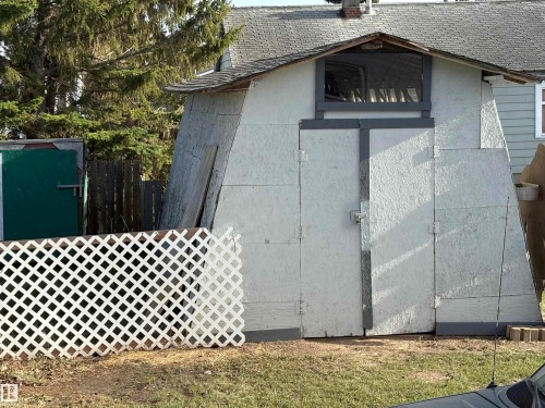 Outbuilding with a peaked roof and a small window above double doors - 115 2Nd Street E, Derwent, AB - Outdoor With Exterior