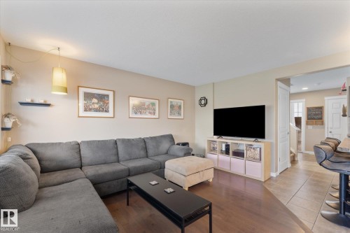 Living area featuring rich wood-finish flooring - 21818 99A Avenue, Edmonton, AB - Indoor Photo Showing Living Room