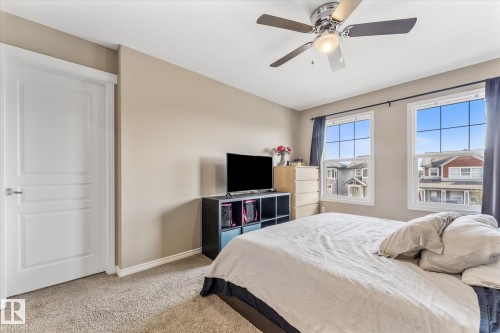 Bright bedroom with neutral wall tones and plush carpet flooring - 21818 99A Avenue, Edmonton, AB - Indoor Photo Showing Bedroom