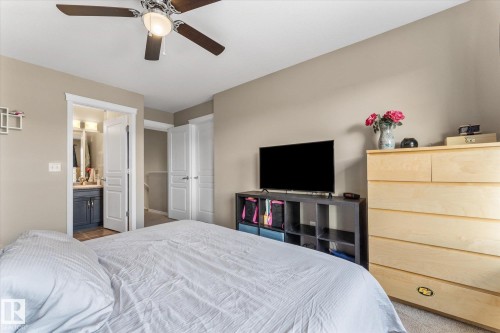 Bedroom featuring neutral wall tones, carpet flooring, and a ceiling fan with integrated lighting - 21818 99A Avenue, Edmonton, AB - Indoor Photo Showing Bedroom