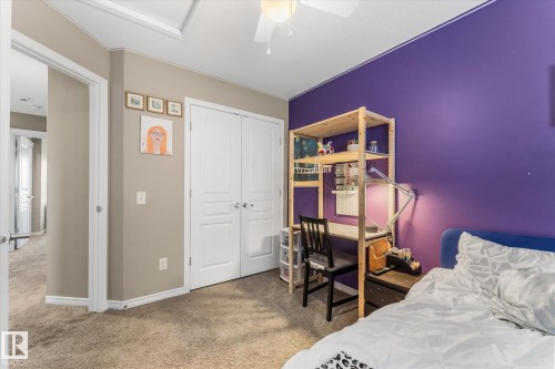 Carpeted room featuring a ceiling fan, recessed lighting, and a neutral wall color complemented by an accent wall - 21818 99A Avenue, Edmonton, AB - Indoor Photo Showing Bedroom