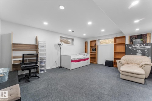 Spacious room featuring neutral carpeting and recessed lighting - 21818 99A Avenue, Edmonton, AB - Indoor