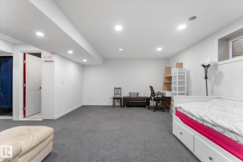 Carpeted lower level room with recessed lighting, white walls, and a built-in window - 21818 99A Avenue, Edmonton, AB - Indoor