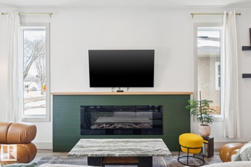 3813 111 Avenue, Edmonton, AB - Indoor Photo Showing Living Room With Fireplace